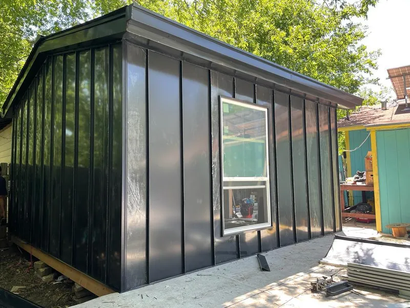 Black standing seam metal wall panels for Roof Inspection in Uvalde