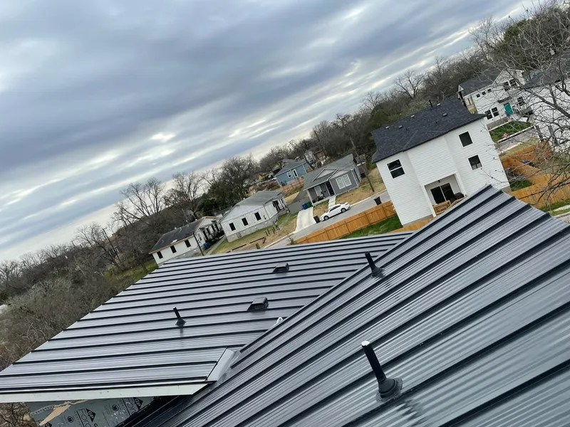 Standing seam metal roof panels with vents for Skylight Repair in Uvalde